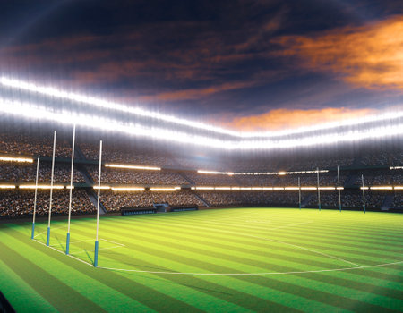 An aussie rules stadium with posts on a marked green grass pitch at night under illuminated floodlights - 3D renderの写真素材