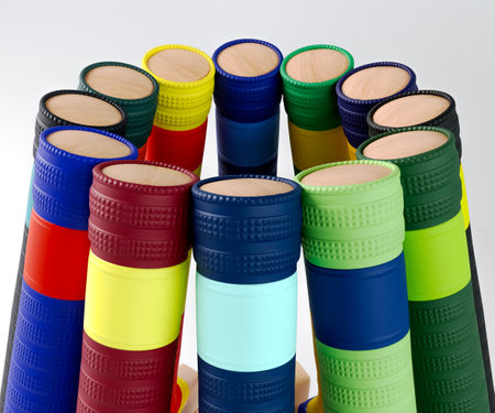 A circular arrangement of cricket bats with various colorful grips on an isolated studio   - 3D...