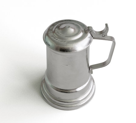 A vintage silver drinking tankard with a lid on an isolated white studio background - 3D renderの写真素材
