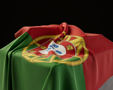 A portugal flag draped over a stone plinth on an isolated dark studio background - 3D renderの写真素材