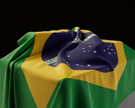 A brazil flag draped over a stone plinth on an isolated dark studio background - 3D renderの写真素材