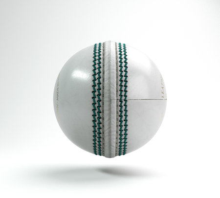 A regular white cricket ball with green stitching on an isolated background - 3D renderの写真素材