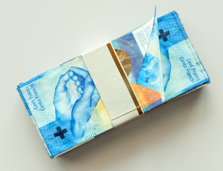 A bundled wad of Swiss Franc banknotes on an isolated light background - 3D renderの写真素材