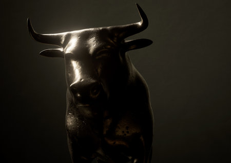 A metal castings depicting a bull in dark dramatic light representing financial market trends - 3D renderの写真素材