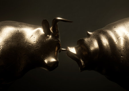 Two bronze metal castings depicting a bull opposing a bear in dark dramatic light representing opposing financial market trends - 3D renderの写真素材