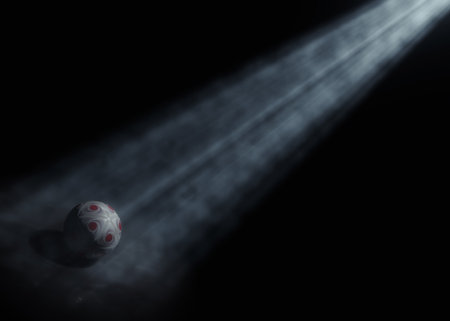 A generic soccer or football sports ball being lit by a single ethereal light rays on a dark black background - 3D renderの写真素材