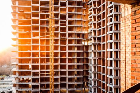 Construction of a high-rise building. Construction site in the city centre.