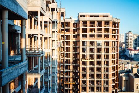 Construction of a high-rise building. Construction site in the city centre.