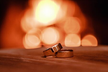 Wedding rings against the background of fire.の写真素材