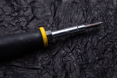 Screwdriver against a dark background