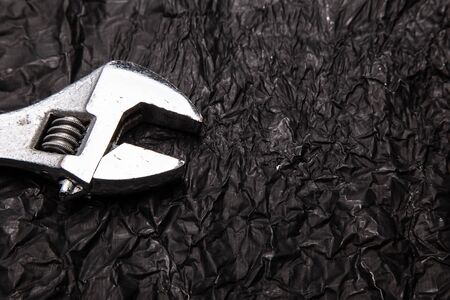 Wrenches on a dark background