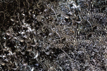 Closeup twisted spiral steel shavings. Drilling milling and lathe industry