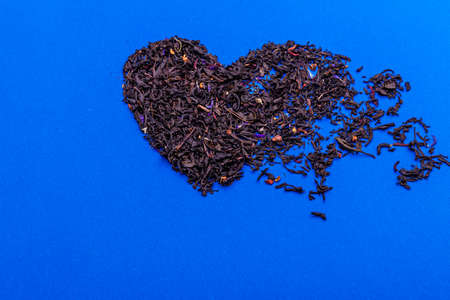 Organic dried tea leaves placed in a heart shapeの写真素材