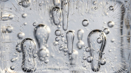 Close-up of water drops in a glass with ice cubes.の写真素材