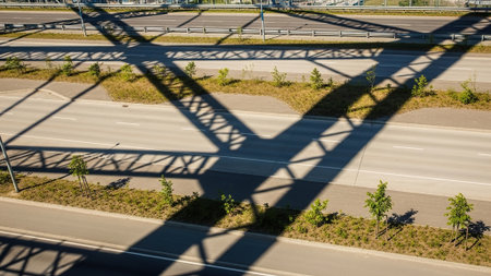 Aerial view of a bridge over a highway in the city.