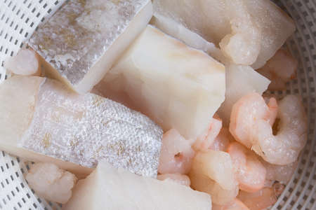 A bowl is filled with chopped raw potatoes. Organic texture as a background.