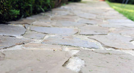 photo of pavement , Concrete cemented pavement Grey Cobblestone sidewalk, walkway.の写真素材