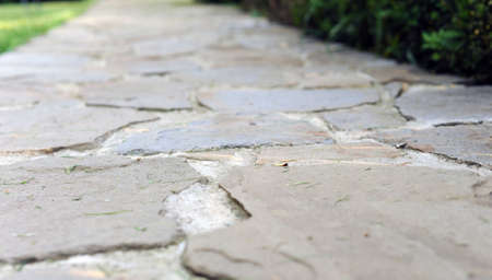 photo of pavement , Concrete cemented pavement Grey Cobblestone sidewalk, walkway.の写真素材