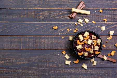 frozen acai bowl with nuts and chocolate, aÃ§ai com castanha de caju