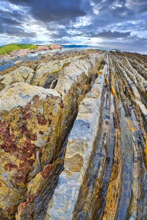 Steeply-tilted Layers of Flysch, Flysch Cliffs, Basque Coast Global Geopark, European Geopark Network, Zumaia, Guipï¿½zcoa, Basque Country, Spain, Europeの写真素材