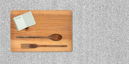 Topview of Set Cooking Wooden Utensils, Cutting Board and Recipe Book on Gray Backgroundの写真素材