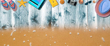 Topview Beach Accessories Background on Sand and Blue Wood