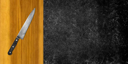 Topview of Cooking Knife and Cutting Board on Dark Backgroundの写真素材