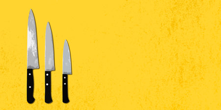 Topview of Set Cooking Knives on Yellow Backgroundの写真素材