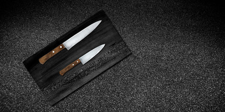 Topview of Cooking Knives and Cutting Board on Dark Background