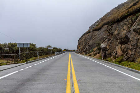 Empty road inside El Cajas National Park in Ecuadorの写真素材