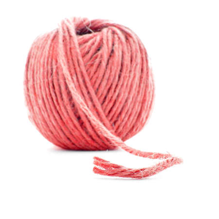 Red wool skein, crochet thread ball, isolated on white backgroundの写真素材