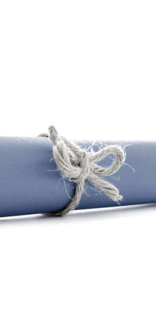 Handmade natural cord knot tied on blue paper scroll, isolated