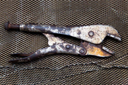 Locking pliers on background Kang Ta wire mess.の写真素材