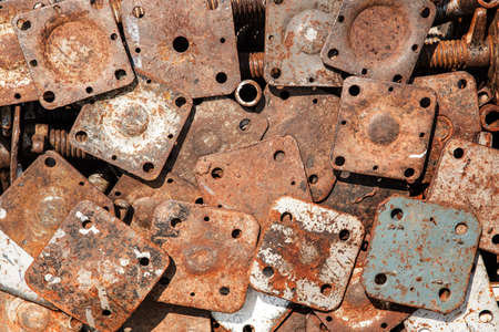 Several rusty iron sheet sizes.