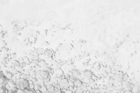 The black background and white weave pattern held.の写真素材