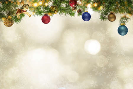 Multi-colored Christmas balls on snow background.の写真素材