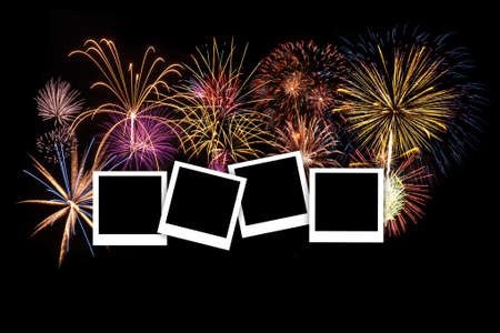 Colorful fireworks lit up the night sky along the frame.の写真素材