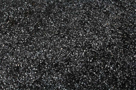 Stone spotted black and white striped background.