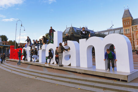 AMSTERDAM,The NETHERLANDS  - October,17, 2013  Tourists are photographed near volume letters IAMSTERDAM on the museum area of the Rijksmuseum in Amsterdam のeditorial素材