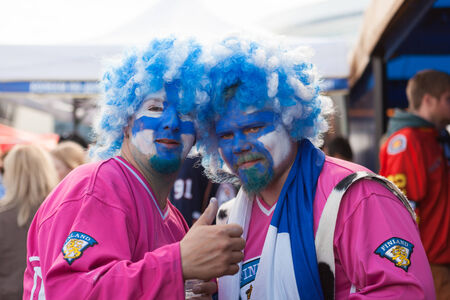 MINSK, BELARUS - May 18, 2014  ICE HOCKEY WORLD CHAMPIONSHIP, MINSK-ARENA, The hockey fans from Finland in funny costumes and wigsのeditorial素材