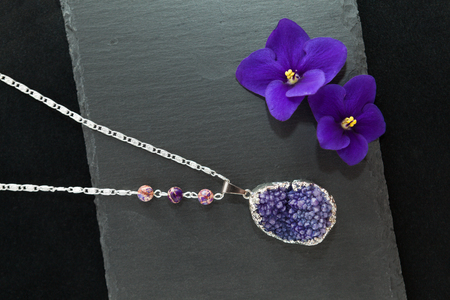 Handmade necklace with druzy violet agateの写真素材