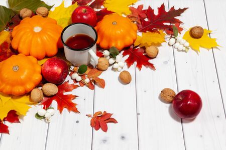 Autumn perspective background with pumpkins and teaの写真素材