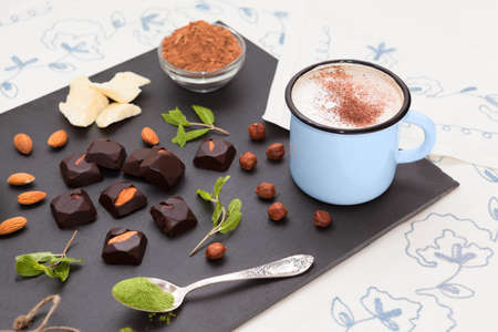 Homemade chocolate sweetmeats with cup of cappuccino