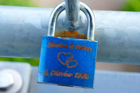 Blue love lock on a railing