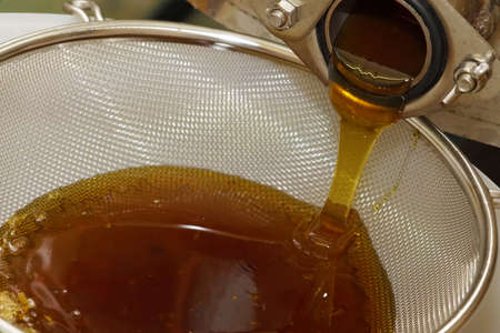 honey flows out of the honey separator