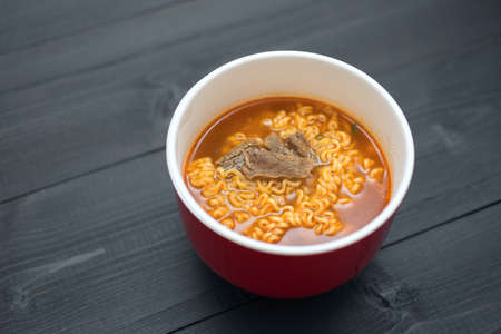 A bowl with noodles with meat