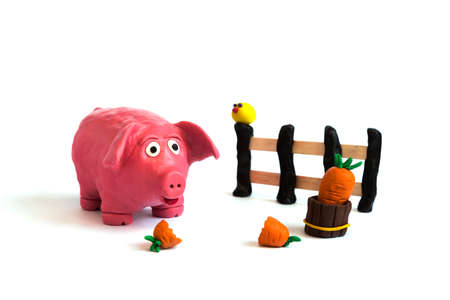 Handmade plasticine clay pig farm on whiteの写真素材