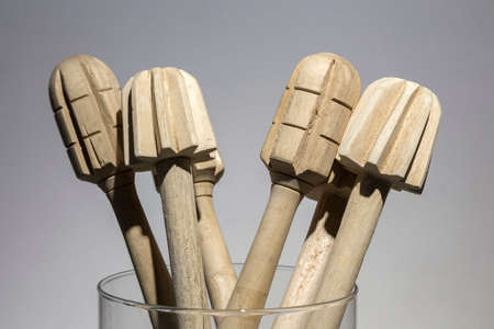 Wooden mashers in glass, close up, macro