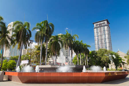 A fountain with palms in Manila, Philippinesのeditorial素材