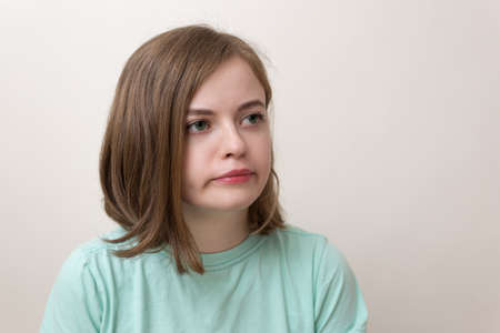 Portrait of young caucasian woman girl with confused, annoyed, frustrated look expressionの写真素材